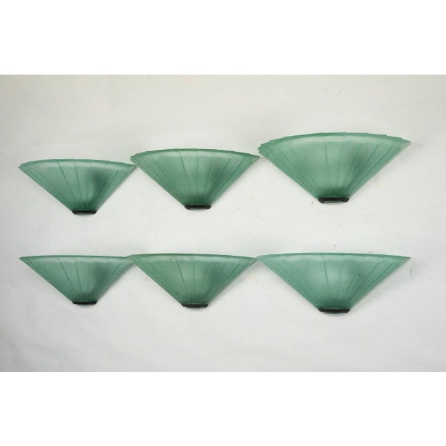 Elegant set of six wall sconces produced by De Majo in the 1980s. Each piece features a fan-shaped design in textured...