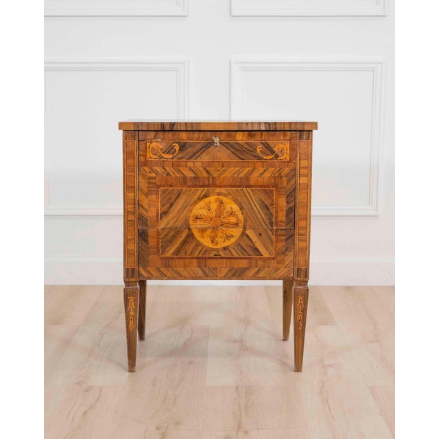 A beautifully proportioned Italian 19th century Louis XVI style bedside table, exquisitely crafted in walnut and richly...