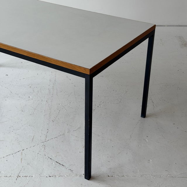 c. 1960s. Finland. White laminate top with wood trim and metal base.
