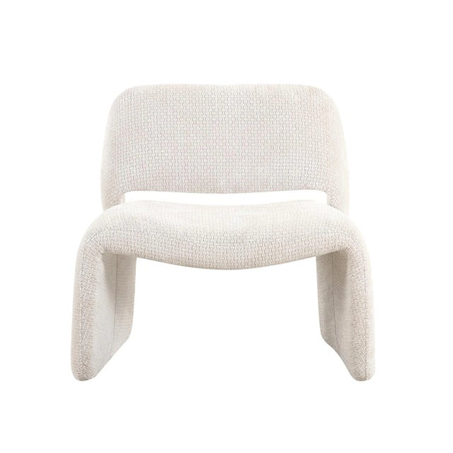 The Zarina chair is a modern, minimalist masterpiece with a sculptural twist, enveloped in textured fabric that adds depth...