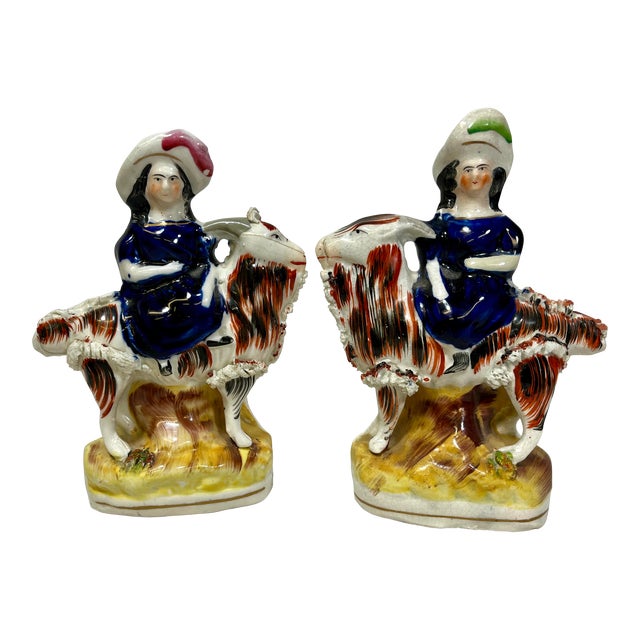 Antique Pair of 19th Century Staffordshire Figurines Depicting Period Dressed Women Riding Goats - From England For Sale