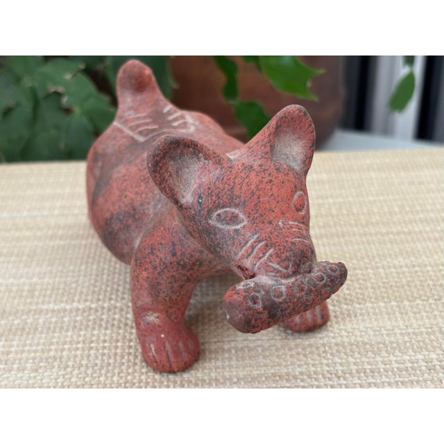 Pre Colombian style clay dog biting corn cob.. Unsure of his actual age but he is probably a midcentury replica. I ship...