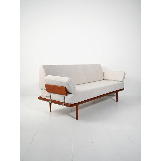 Two-arm sofa by Peter Hvidt & Orla Mølgaard-Nielsen for France & Søn, 1960s. Teak frame, steel brackets, branding present....