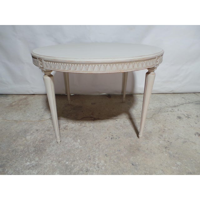 This is a unique Swedish Gustavian style round table. its been restored and repainted with Milk Paints Oyster White.