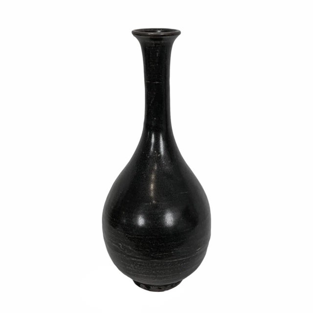 Vintage black ceramic flute vase. Attractive hand thrown and glazed pottery. Each is slightly unique in finish glaze....