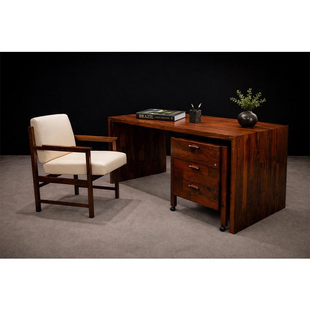 Produced by Bureau Móveis in the 1960s, this pair of armchairs reflects the disciplined formal language of Brazilian...