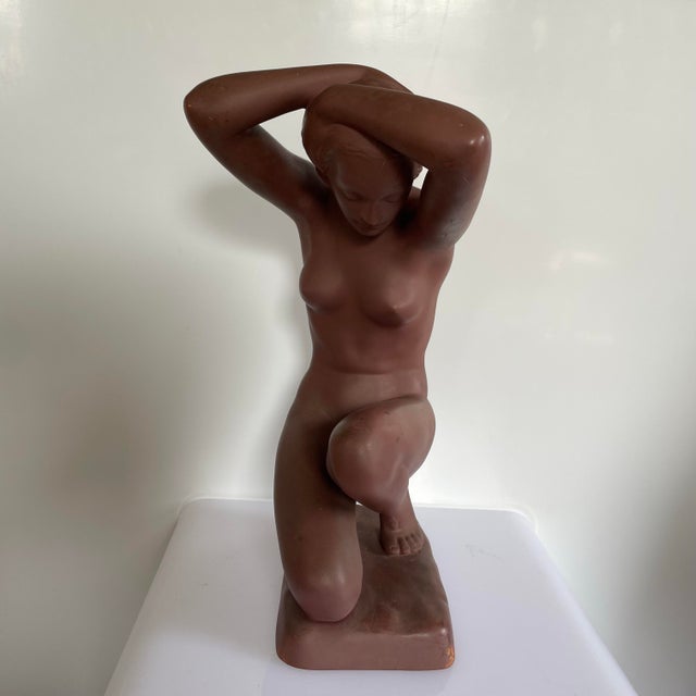 This item is a sculpture called Damenakter or nude woman designed by Josef Lorenzi for Goldenscheider Manufactory Vienna...