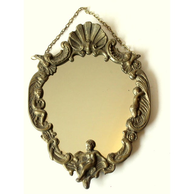 1950s - beautifull small wall mirror - made of brass, mirror glass and wood - in good vintage condition with approx. 7.67"...