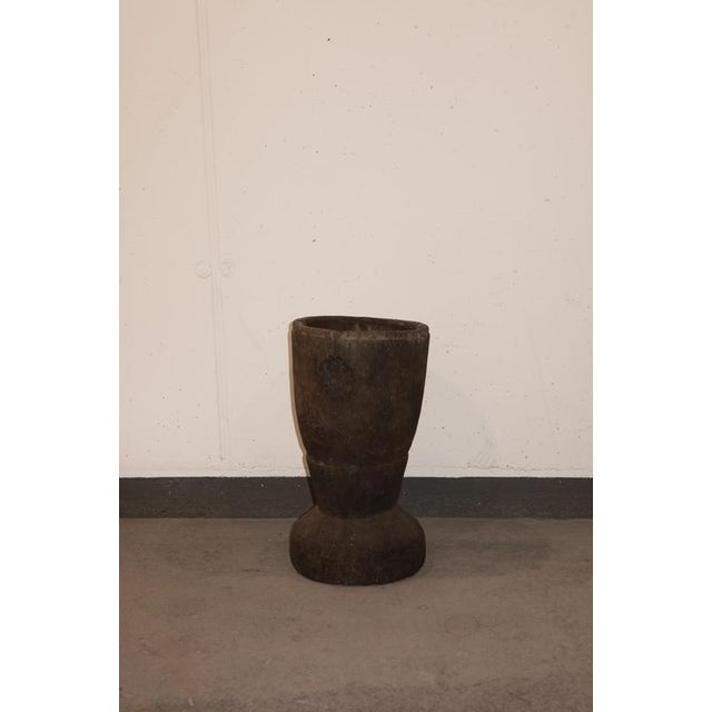 African grain stompers are hand-made when tree trunks are hollowed out and then used to grind grain. These have been...