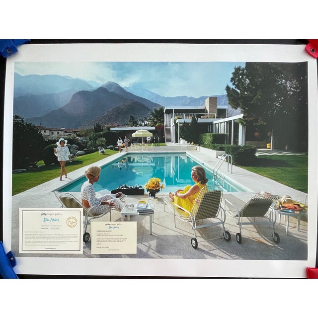 "Poolside Gossip", Palm Springs 1970, 30" x 40" C-Print by Slim Aarons The quintessential symbol of mid-century modern...
