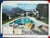 "Poolside Gossip", Palm Springs 1970, 30" x 40" C-Print by Slim Aarons The quintessential symbol of mid-century modern...