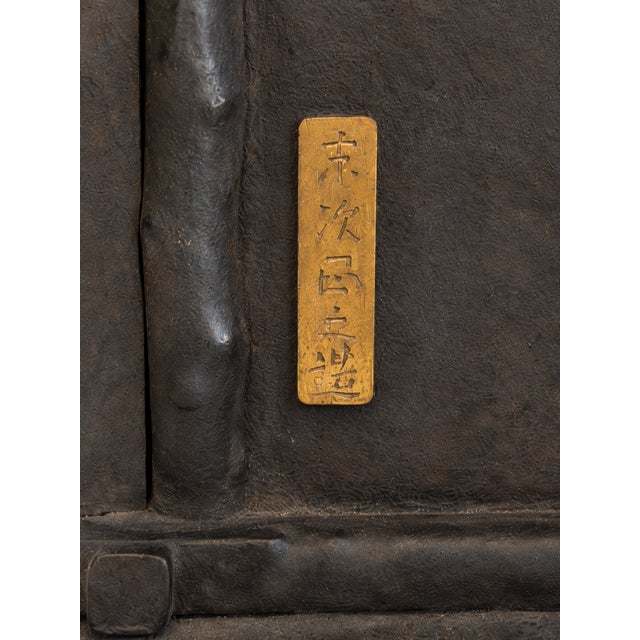 An exceptional antique Japanese cast iron house-shaped oil lantern (Andon/Tsuridoro). This premium architectural...