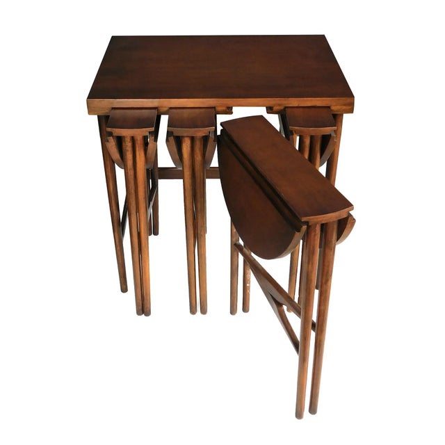 this cleverly designed mid-century set of nesting tables designed by Bertha Schaefer (American 1895-1971) for M. Singer &...