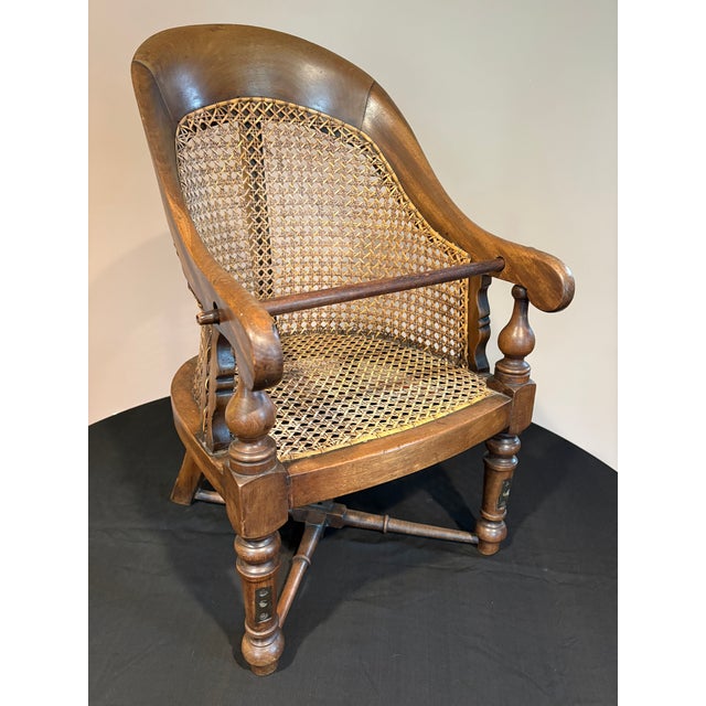 Offered for your consideration, an English Regency child’s barbering chair. This rare and charming piece features a walnut...
