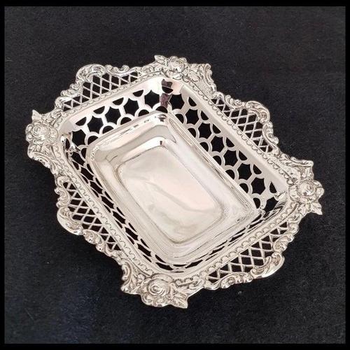 A fine late Victorian English sterling silver trinket dish by the celebrated William Comyns & Sons, fully hallmarked in...