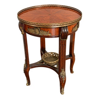 Old World Elegance | Antique French-Style Marquetry Guéridon Table With Brass Mounts and Decorative Basket For Sale