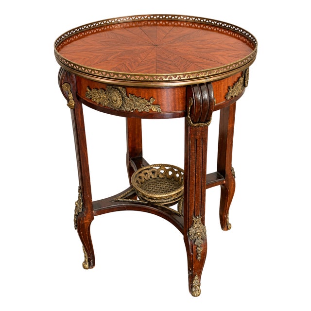 Old World Elegance | Antique French-Style Marquetry Guéridon Table With Brass Mounts and Decorative Basket For Sale