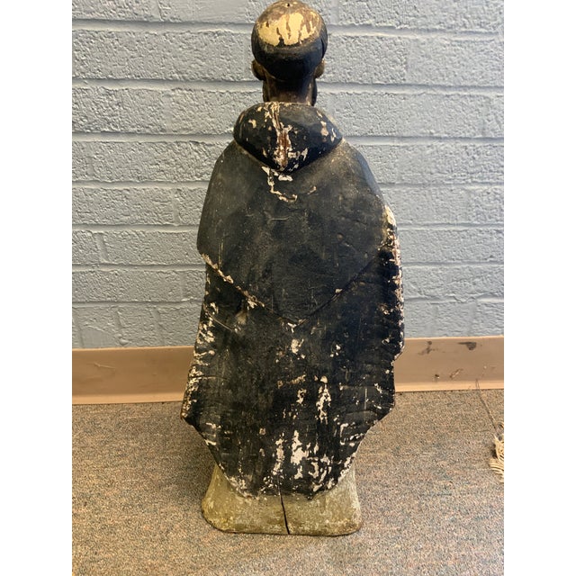 19th Century Standing Santos figure. The statue retains its original aged patina surface, but it is missing both of its...