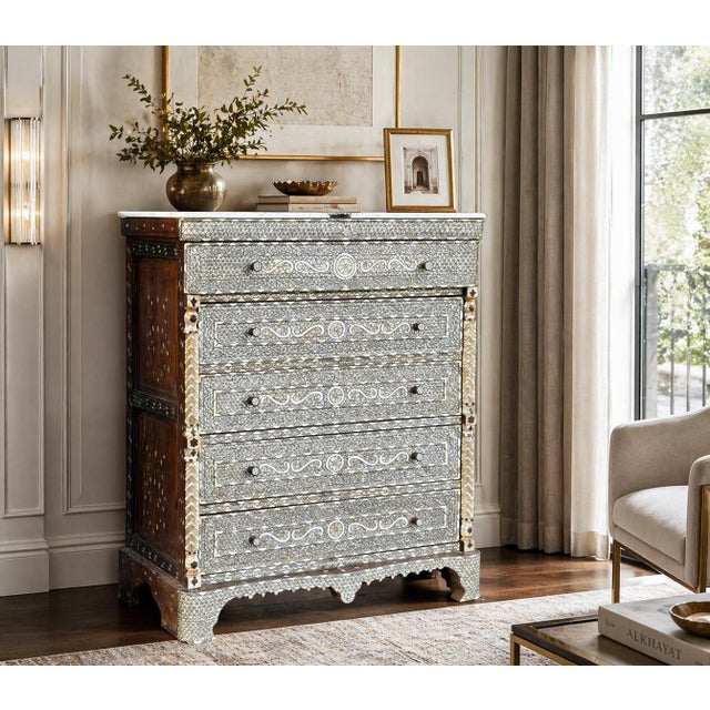 Exotic handcrafted mother of pearl inlaid chest with drawers with natural marble top. The front almost all covered with...
