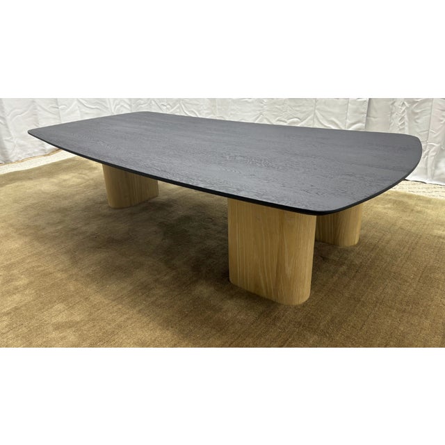 Arhaus Sculptural Two-Tone Coffee Table Organic Modern Form | Matte Black Top with Blonde Wood Legs Open Box | Excellent...