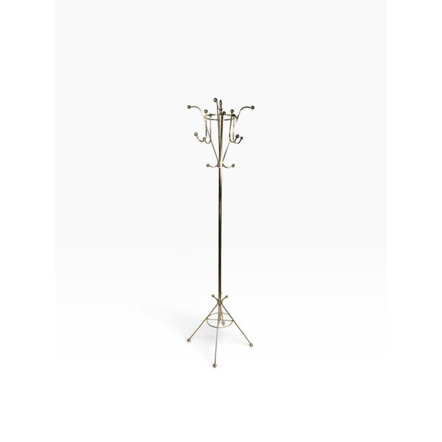 Exceptional glamorous brass plated coat tree stand, in excellent, original, clean and ready to use condition. The stand...