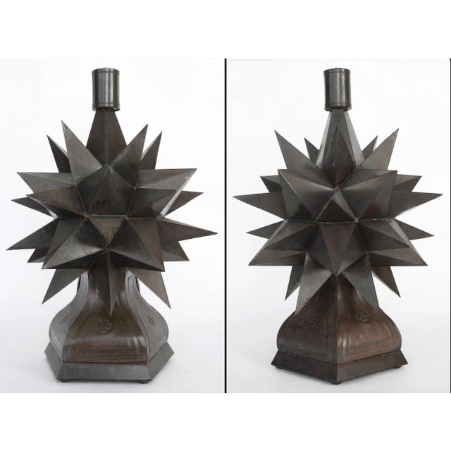 An incredible rare pair of vintage blackened metal sculptures with a three dimensional sputnik morning star design...