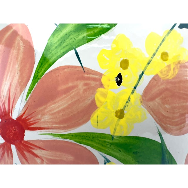 This beautiful ginger jar showcases a vibrant hand-painted floral motif, with soft pink and red blossoms surrounded by...