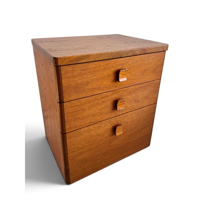 A beautifully understated teak chest of drawers designed by Ron Carter for Stag as part of the Cantata Collection, circa...