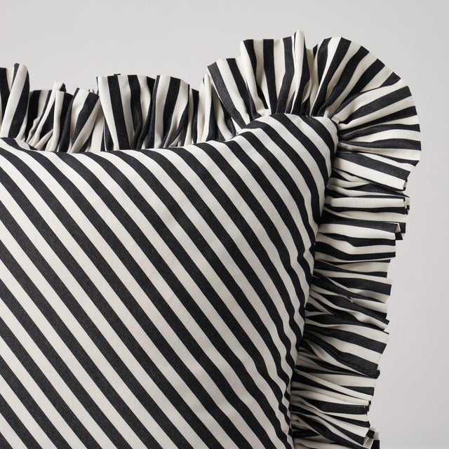 This pillow features Brigitte Stripe with a 1.5" ruffle finish. The perfect thin stripe, not too casual and not too...