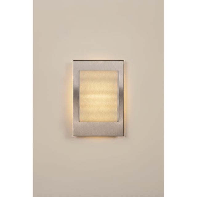 Introducting Frame, a collection of handcrafted wall sconces. Featuring a minimalist design, simple forms, and the subtle...