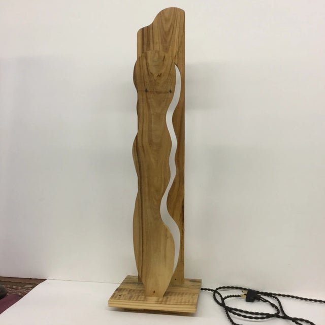 These lamps are so unique and all one of a kind. Made by artisan woodworkers, the lamp sits upright and super tall....