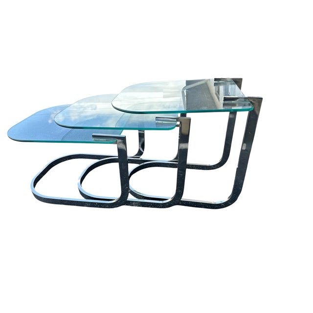These are nickel plated nesting tables. They are in Milo Baughman style. Great condition!