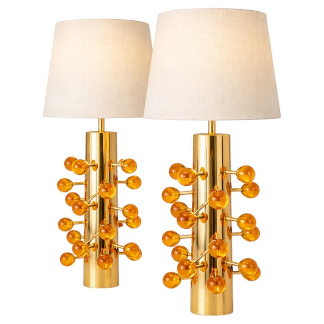 A sculptural chandelier in authentic Murano glass, featuring a sophisticated composition of teardrop-shaped elements in...