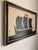 A striking large-scale maritime silhouette rendered in black against a softly aged off-white ground. The bold simplicity...