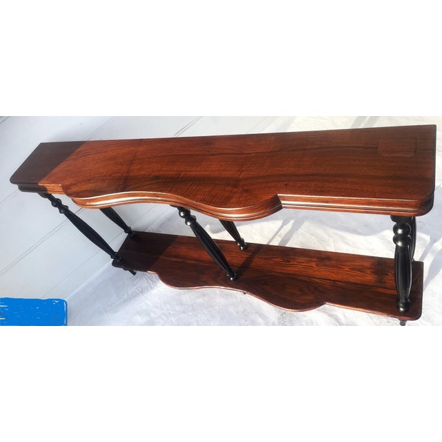 This elegant, slender, antique console table from the turn of the 19th and 20th centuries showcases a classic style...