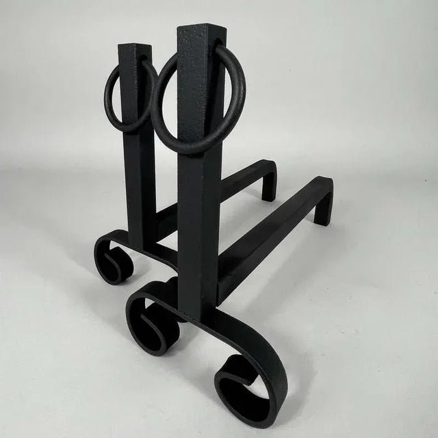 These modernist cast iron fire dogs were designed and manufactured in France in the 1930s. The fire dogs are traditional...