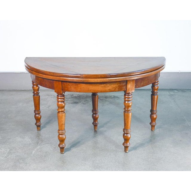 Half-moon-shaped extendable console table in walnut. 19th century period 19th century materials solid walnut dimensions ø...