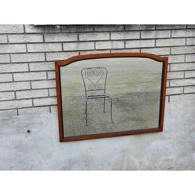 This antique 1920 English style wall mirror is a stunning piece of home decor, crafted from cherry wood with a brown...