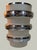 8.25” high 5” wide at top, thick wide bands of sterling silver encompass this very unusual vase. Intricate designs are cut...