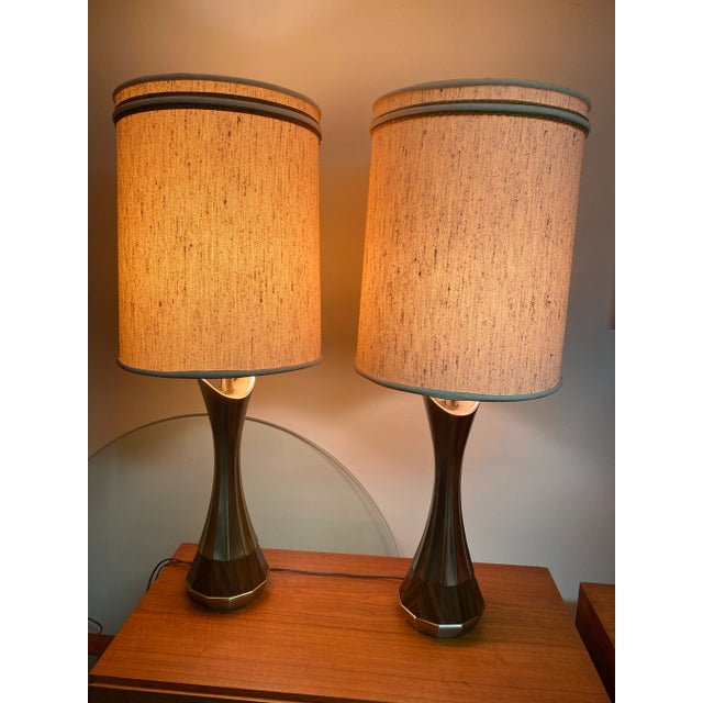 Beautiful pair of lamps (price for pair) mid-century laurel lamps. The bases are metal and faux wood and they are in...