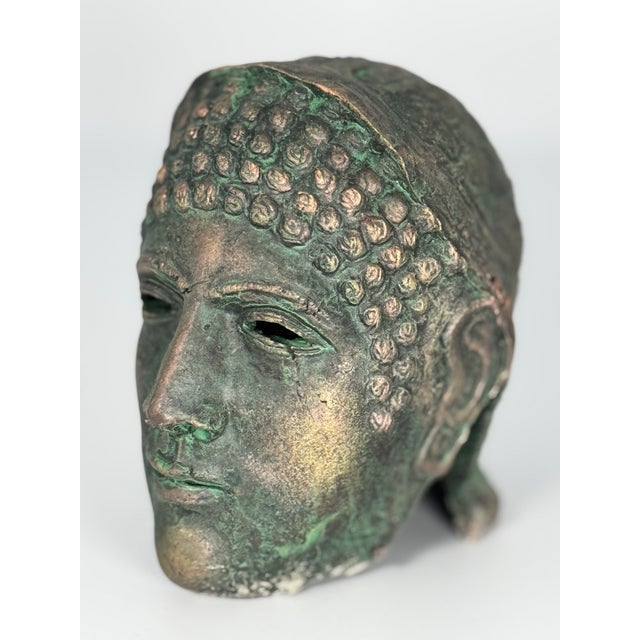 This striking lightweight metal sculpture is a modern decorative piece inspired by ancient Greco-Roman and Gandharan art....