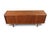 This credenza was made in Denmark during the 1960s, with a teak case featuring square pull hardware on the drawers and...