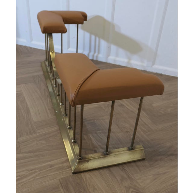 Leather Upholstered Brass Club Fender This is a stylish piece, it is made in brass the seats are upholstered in Golden tan...