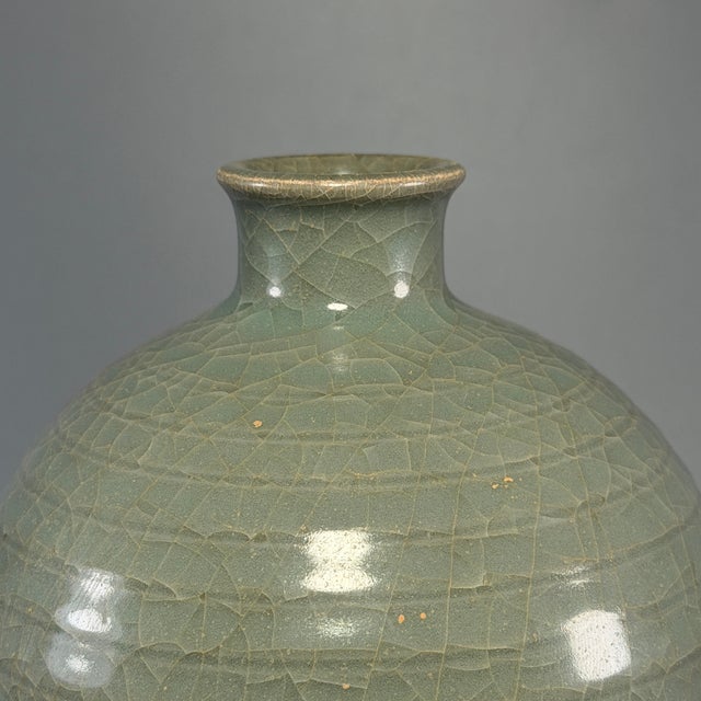Fine antique Chinese celadon meiping vase. Classic elegant tapered silhouette with small short neck, covered in natural...