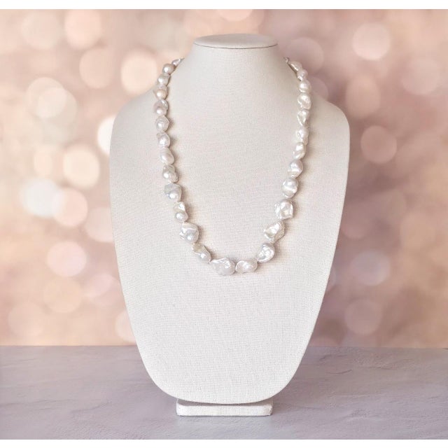 Presented here is a truly exceptional necklace composed of large natural baroque pearls of remarkable scale and character....