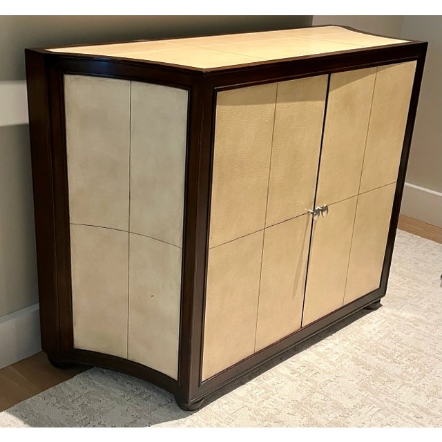 The unusual and beautiful piece from Kreiss features cream-colored parchment leather panels trimmed in dark brown stained...