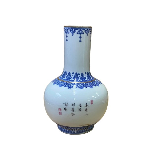 This is an oriental Chinese vase with a white base and oriental flower birds graphic scenery graphics. Dimensions: Dia...