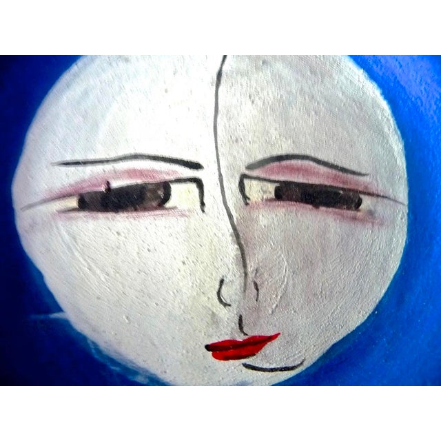 A haunting face painted on a rough Mexican clay plate. Unglazed, it has a visual grab of roughness contrasted with the...