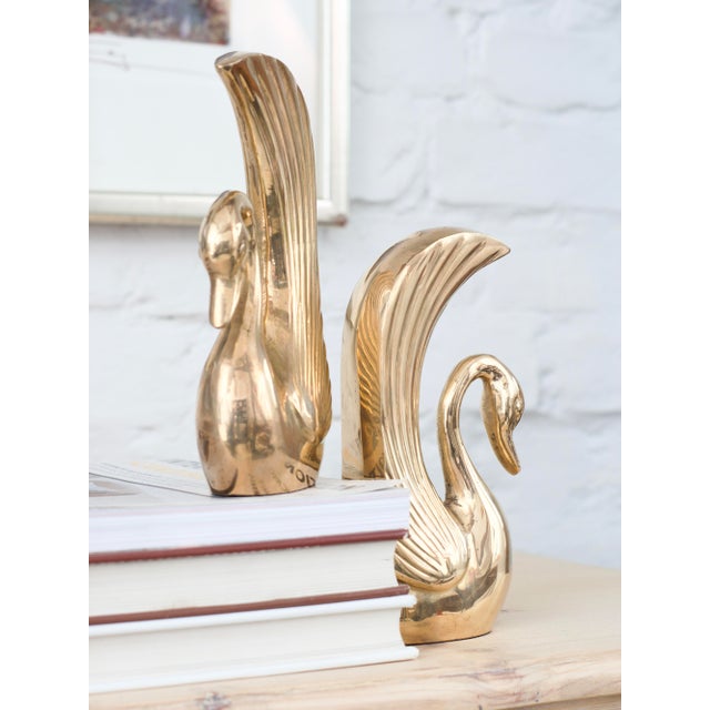 A pair of brass bookends in the shape of swans. Germany 1950s, Very good condition. Dimensions: height 18 cm, width 9 cm,...