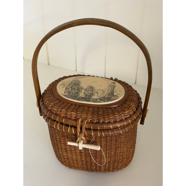 A beautiful 1978 Farnum Nantucket Lightship Basket, featuring finely handwoven construction, a warm wooden base and lid,...